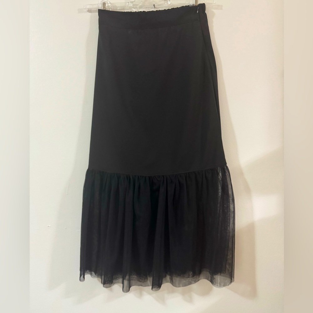 La robe black midi skirt with a tulle hem.